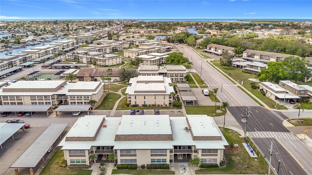 an aerial view of residential houses with outdoor space