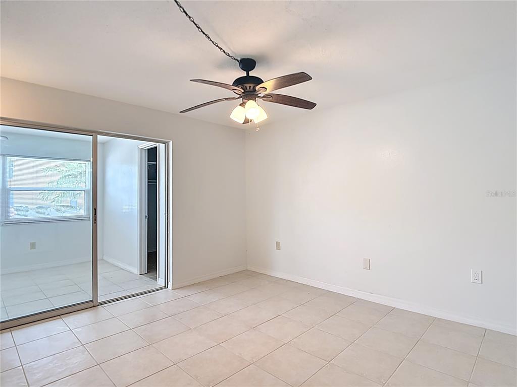 5132 Amulet Drive, Unit 105 New Port Richey, FL 34652 - Photo 18 of 42 wooden floor in an empty room