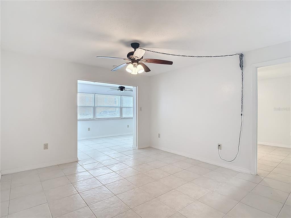 5132 Amulet Drive, Unit 105 New Port Richey, FL 34652 - Photo 24 of 42 an empty room with closet and windows