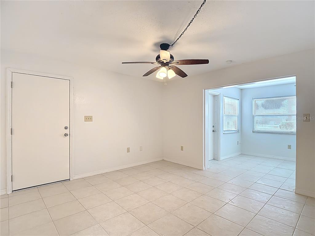 5132 Amulet Drive, Unit 105 New Port Richey, FL 34652 - Photo 26 of 42 an empty room with closet and windows
