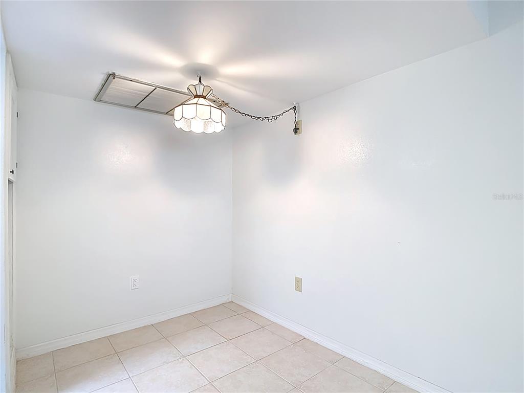 5132 Amulet Drive, Unit 105 New Port Richey, FL 34652 - Photo 27 of 42 a very nice looking room with a fan