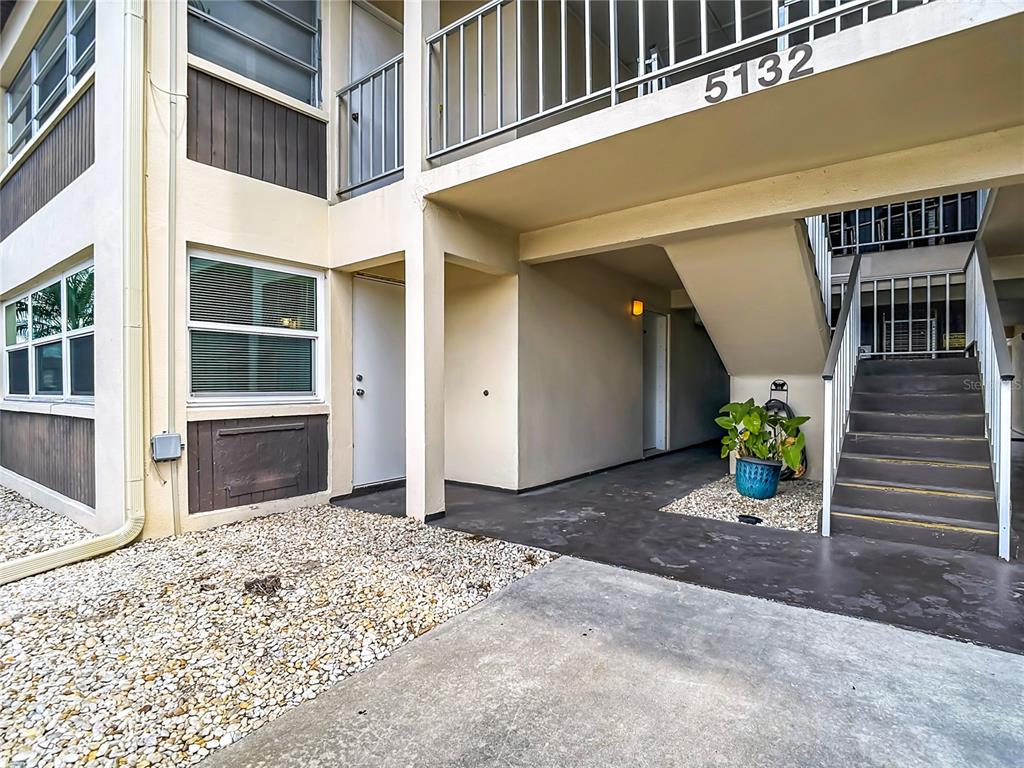 5132 Amulet Drive, Unit 105 New Port Richey, FL 34652 - Photo 30 of 42 a view of a house with a outdoor space