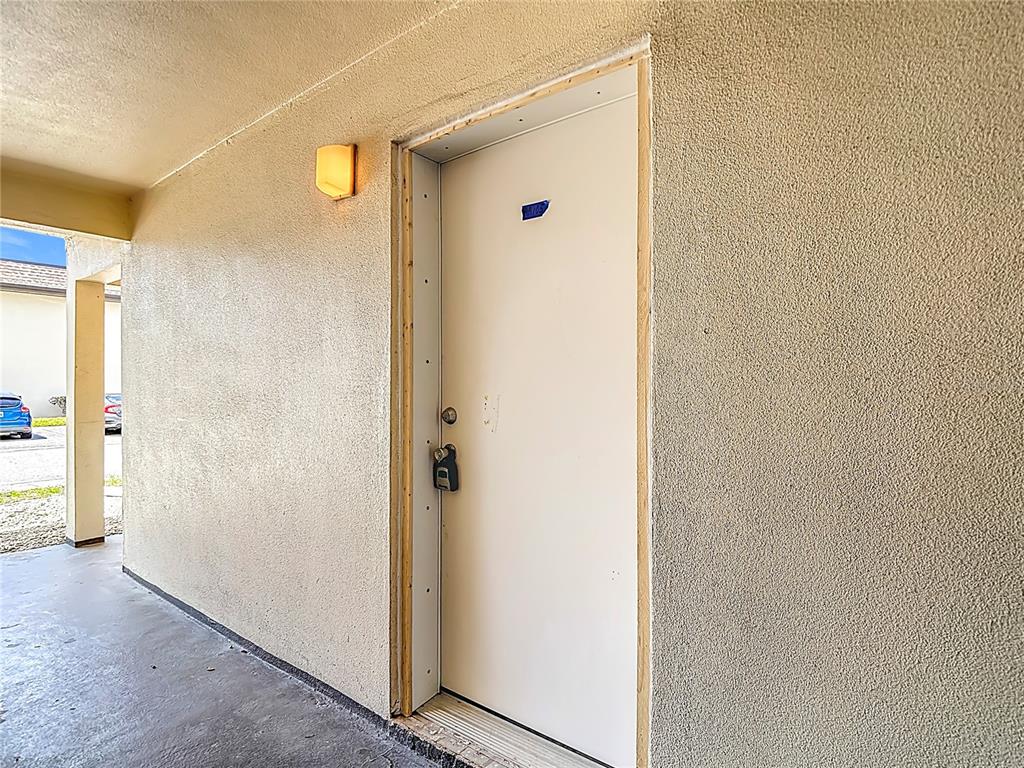 5132 Amulet Drive, Unit 105 New Port Richey, FL 34652 - Photo 32 of 42 a view of a bathroom with a shower