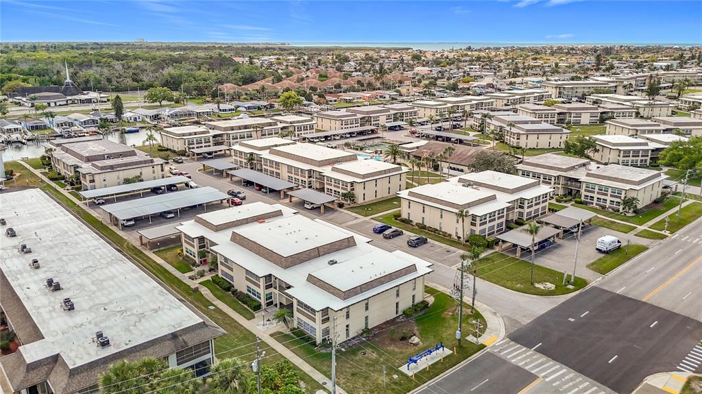 5132 Amulet Drive, Unit 105 New Port Richey, FL 34652 - Photo 38 of 42 an aerial view of residential houses with outdoor space
