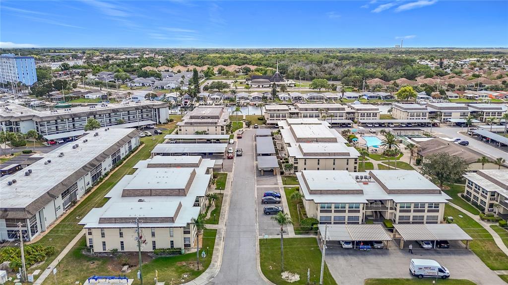 5132 Amulet Drive, Unit 105 New Port Richey, FL 34652 - Photo 40 of 42 an aerial view of residential houses with outdoor space
