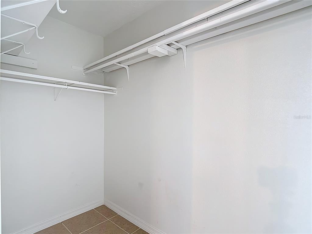 5132 Amulet Drive, Unit 105 New Port Richey, FL 34652 - Photo 7 of 42 a view of an empty walk in closet