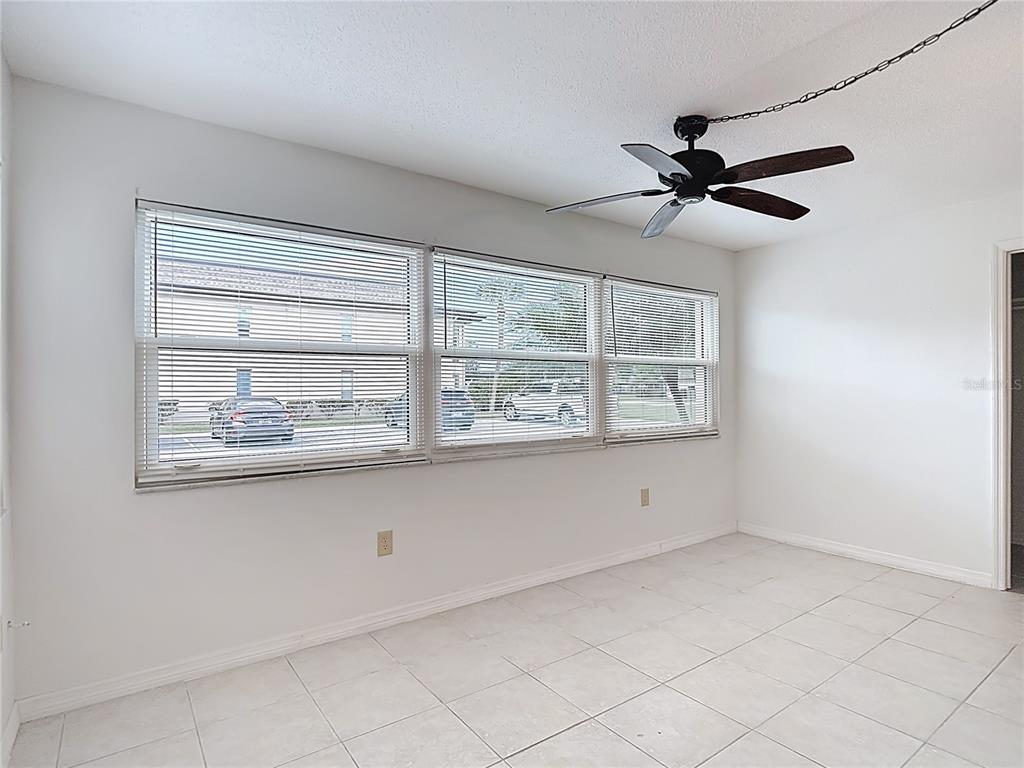 5132 Amulet Drive, Unit 105 New Port Richey, FL 34652 - Photo 8 of 42 a view of an empty room with a window