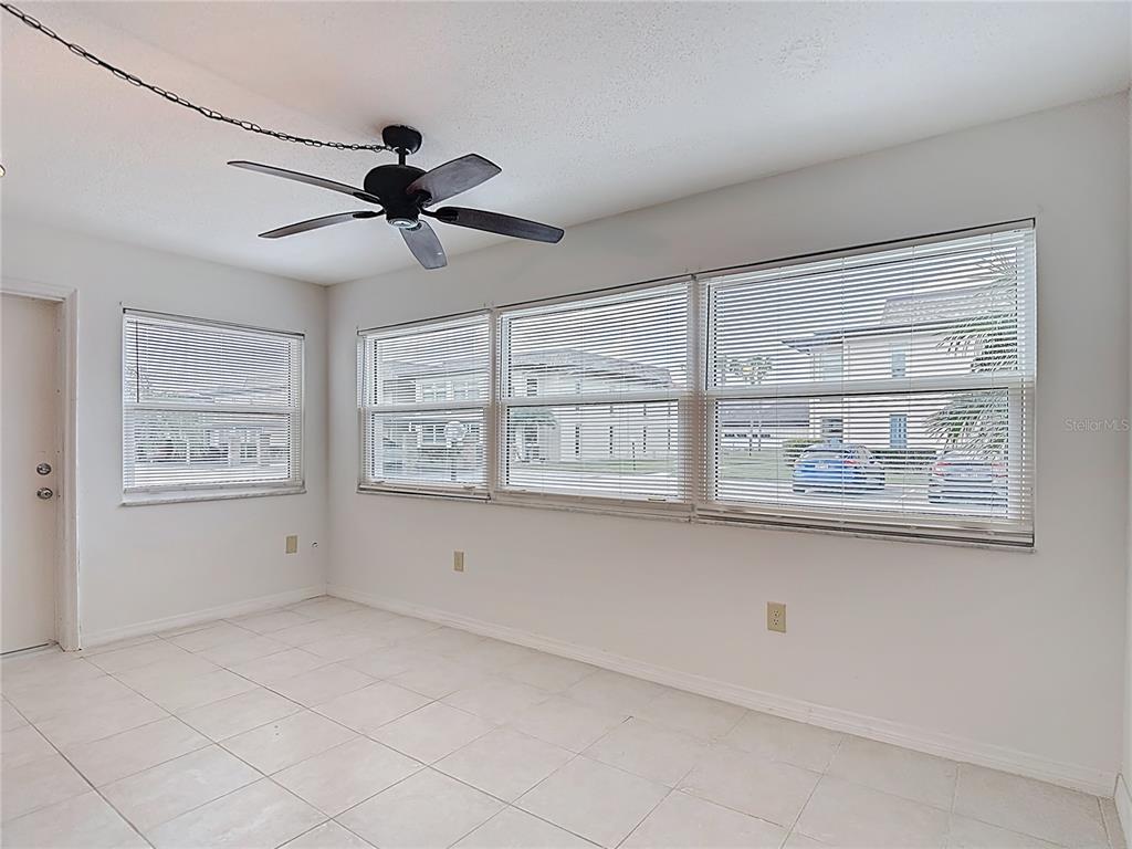 5132 Amulet Drive, Unit 105 New Port Richey, FL 34652 - Photo 10 of 42 a view of an empty room with a window