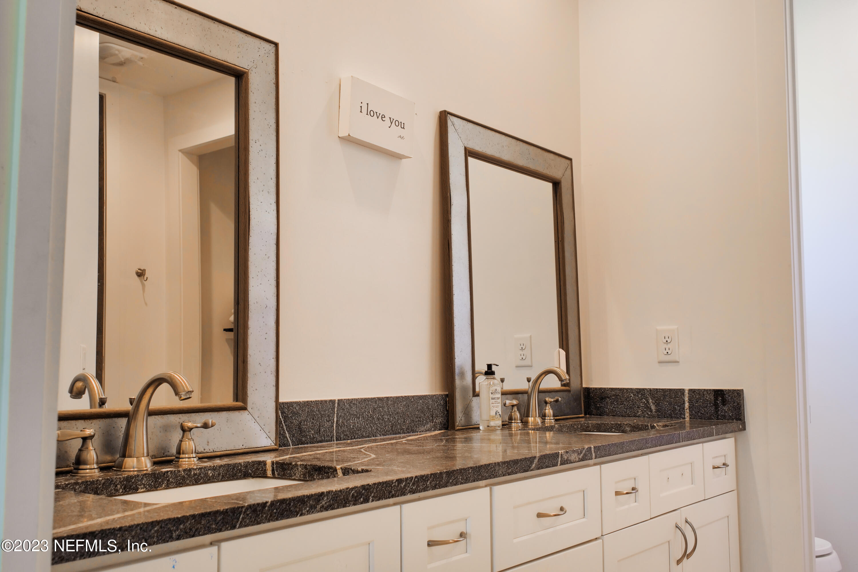 5125 Gracewood Lane St. Augustine, FL 32092 - Photo 11 of 21 a bathroom with a double vanity sink and a mirror