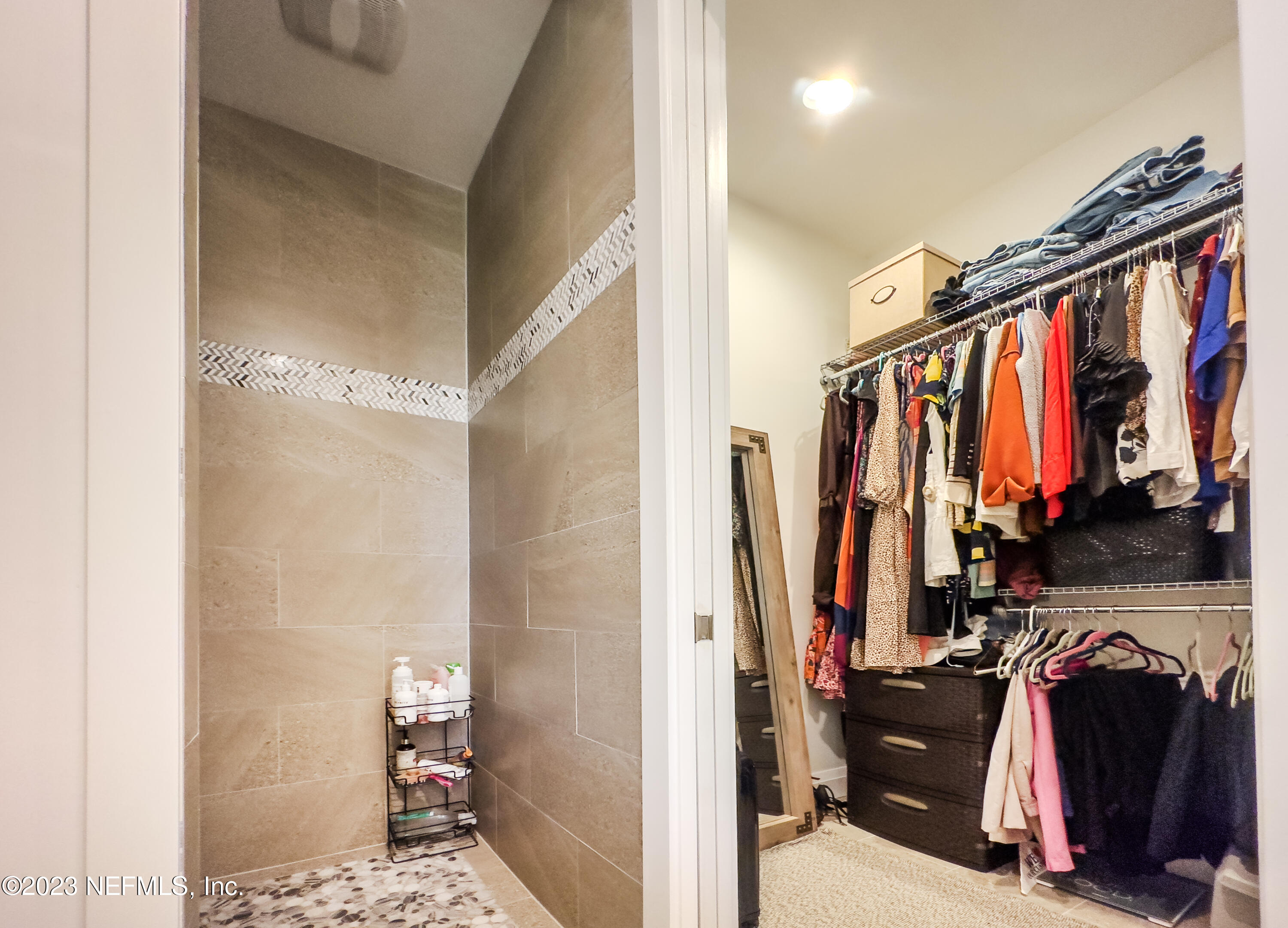 5125 Gracewood Lane St. Augustine, FL 32092 - Photo 13 of 21 a view of walk in closet with clothes and shoes