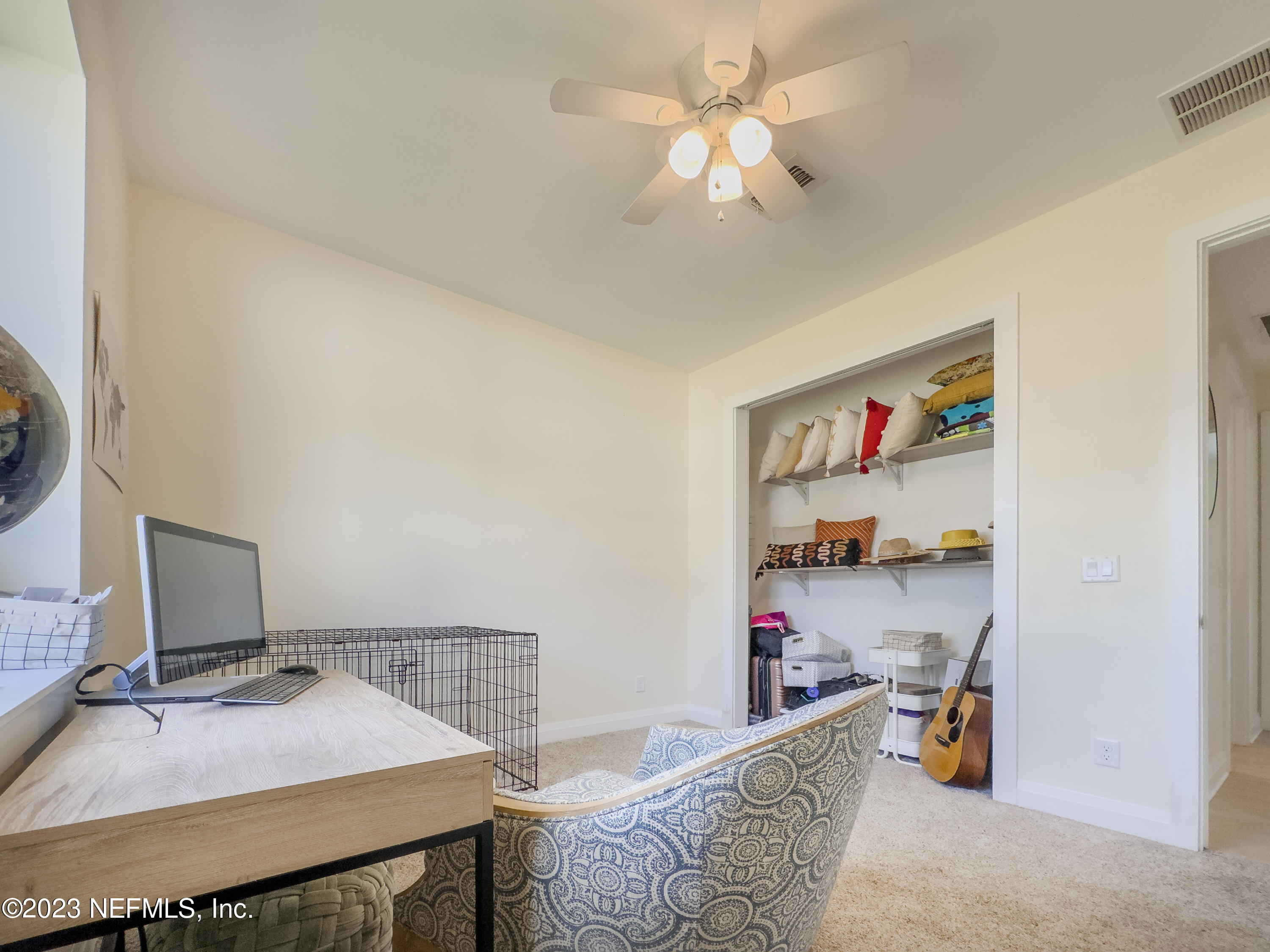 5125 Gracewood Lane St. Augustine, FL 32092 - Photo 15 of 21 a bedroom with a bed and a chandelier