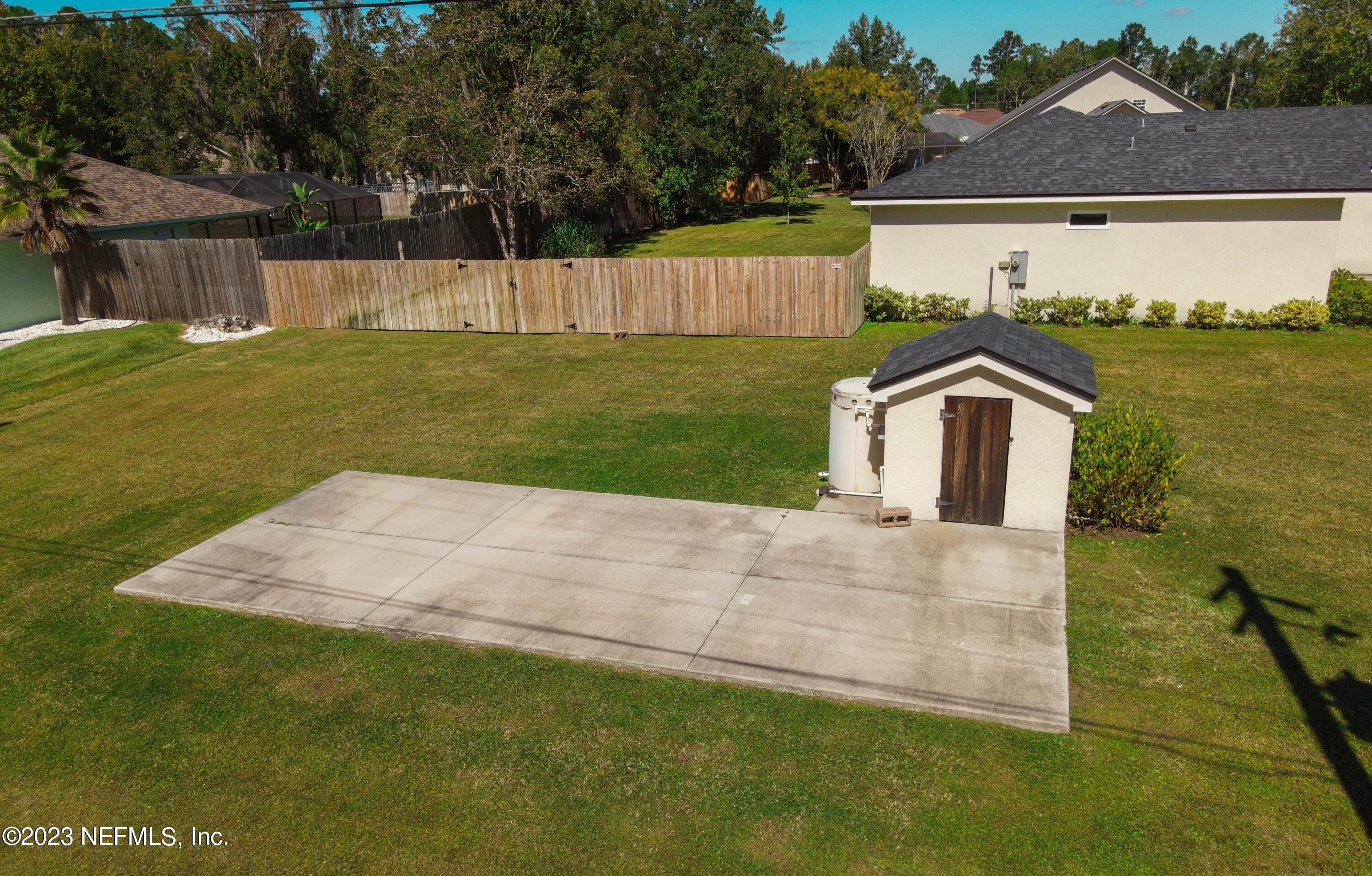 5125 Gracewood Lane St. Augustine, FL 32092 - Photo 19 of 21 a view of a house with a yard and a large tree