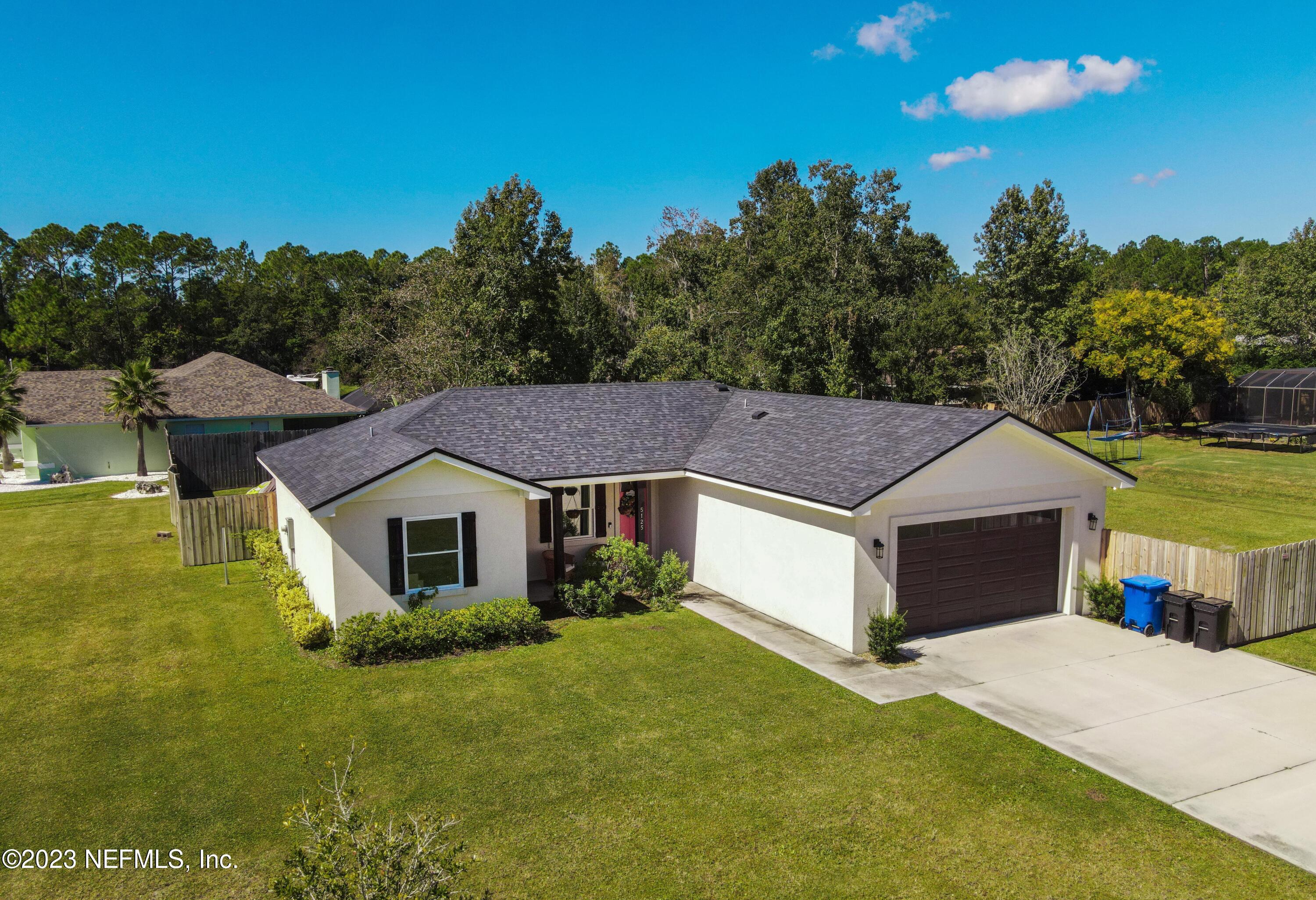 5125 Gracewood Lane St. Augustine, FL 32092 - Photo 2 of 21 a aerial view of a house with a yard and a large tree