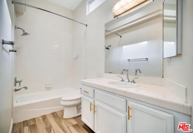 a bathroom with a sink a toilet and a bathtub