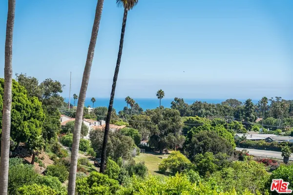 a view of a lake with sitting area