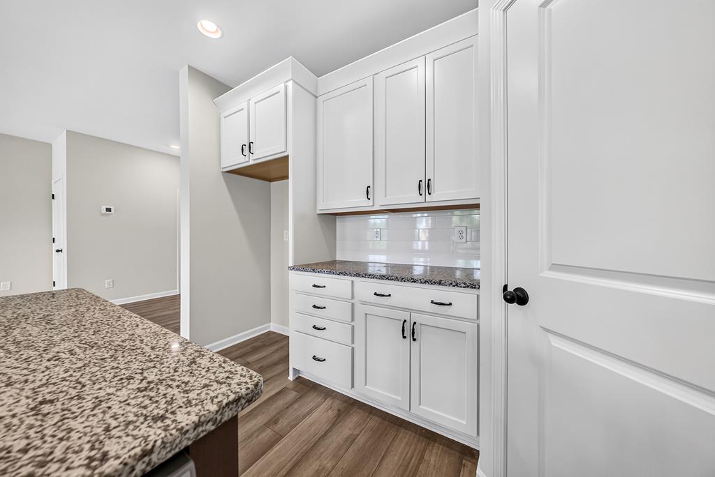 6 Liberty Place Fort Mitchell, AL 36856 - Photo 13 of 27 a kitchen with granite countertop white cabinets and refrigerator
