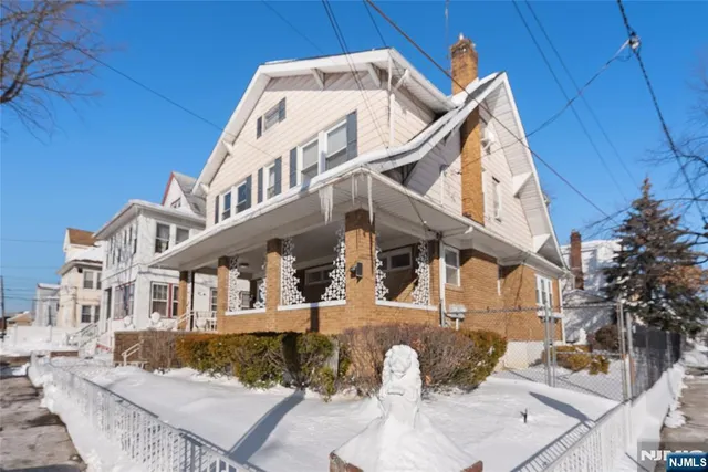 a view of a white building among the street