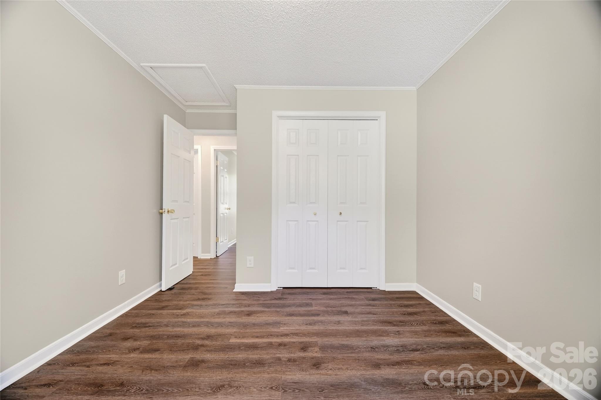 1919 Oak Hollow Road Gastonia, NC 28054 - Photo 17 of 36 a view of an empty room with wooden floor