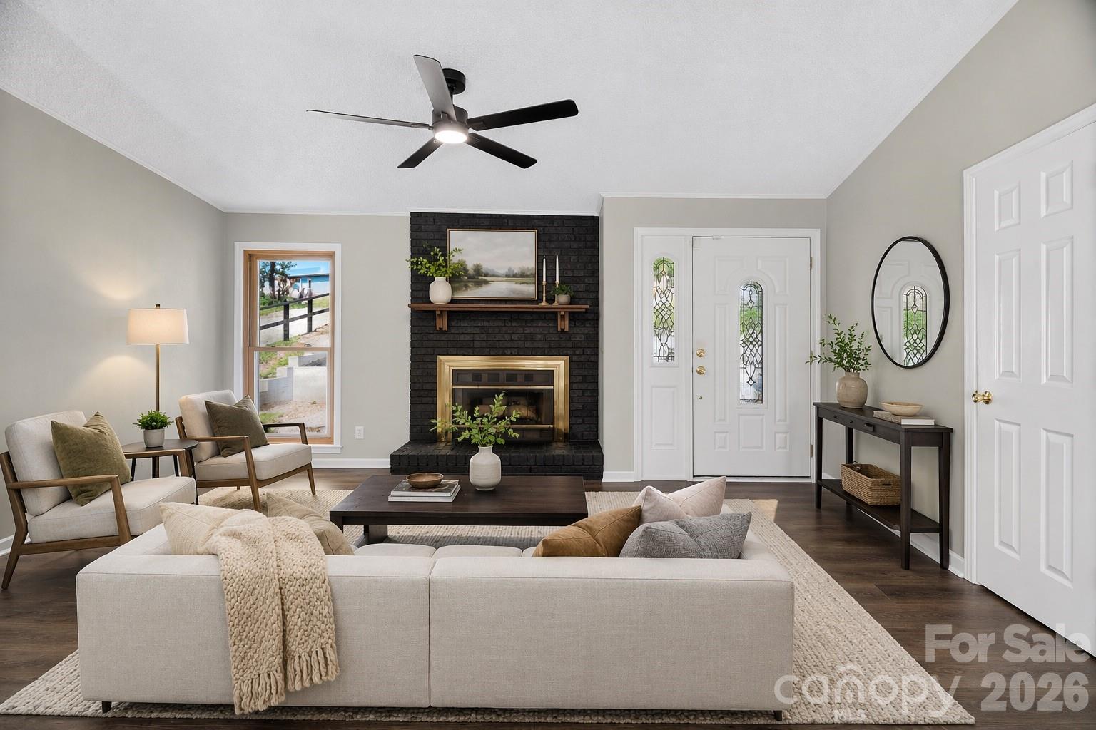1919 Oak Hollow Road Gastonia, NC 28054 - Photo 2 of 36 a living room with furniture a window and a fireplace