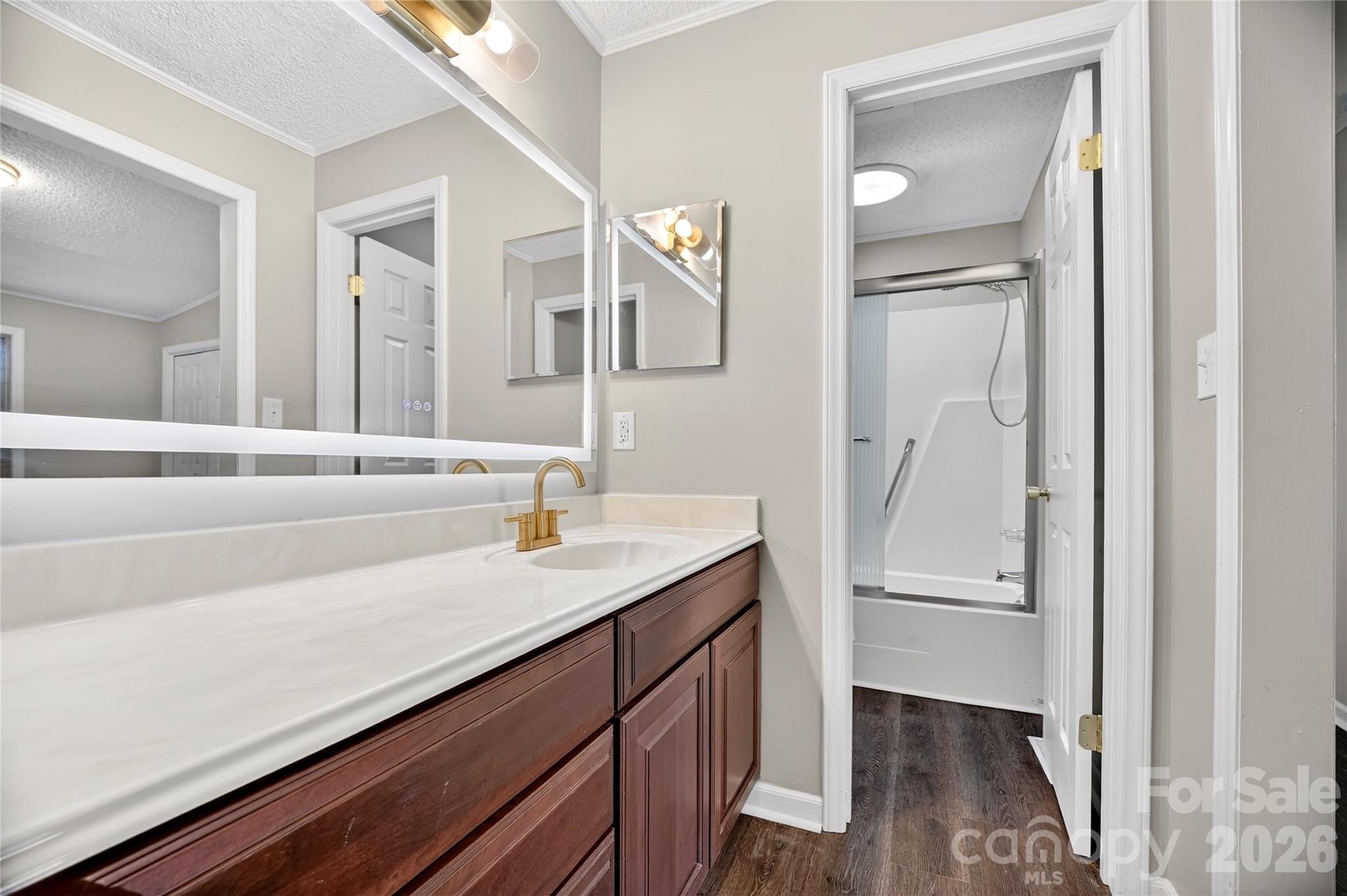 1919 Oak Hollow Road Gastonia, NC 28054 - Photo 21 of 36 a bathroom with a sink and a mirror