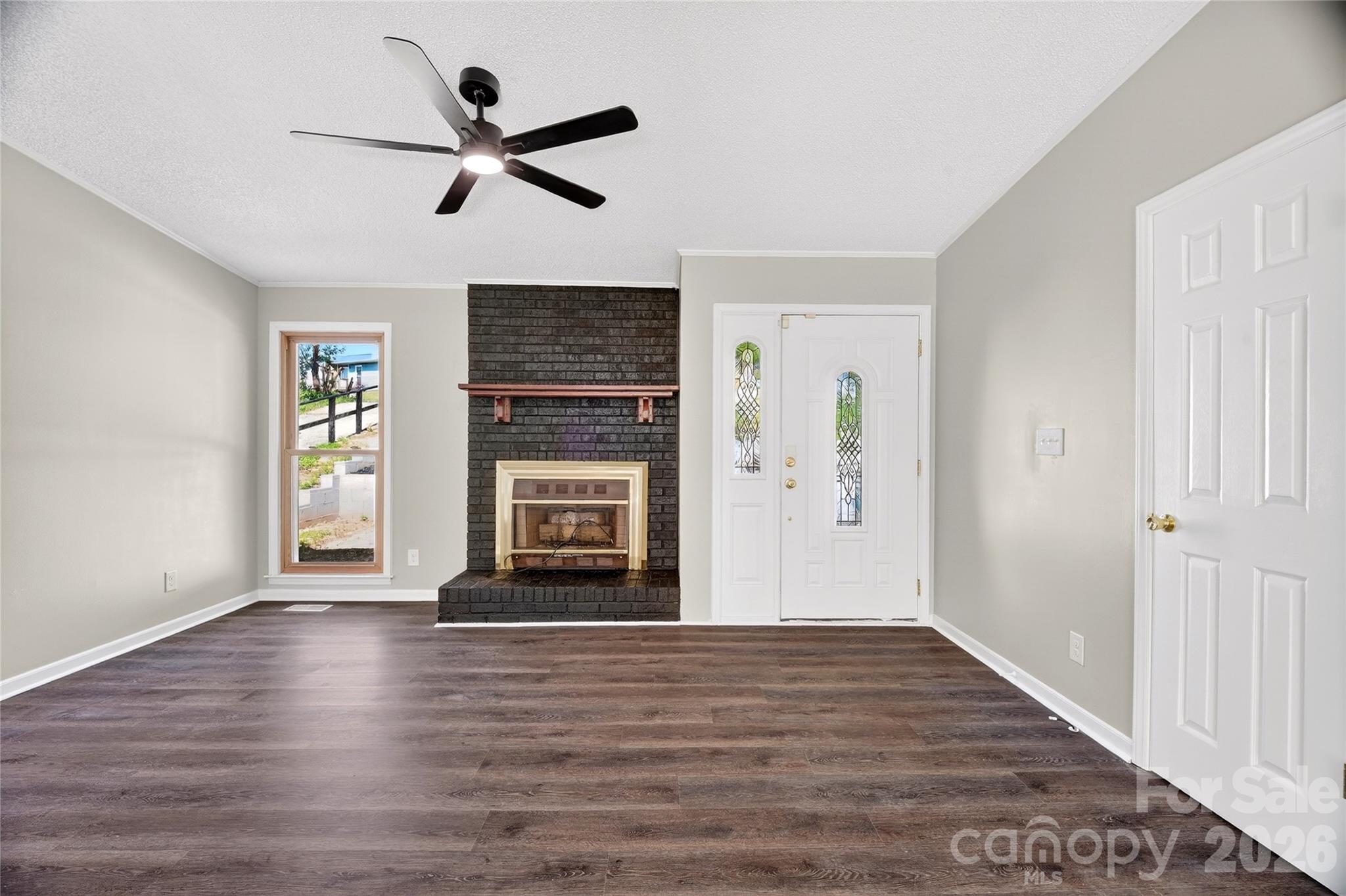 1919 Oak Hollow Road Gastonia, NC 28054 - Photo 3 of 36 a view of empty room with wooden floor and a window