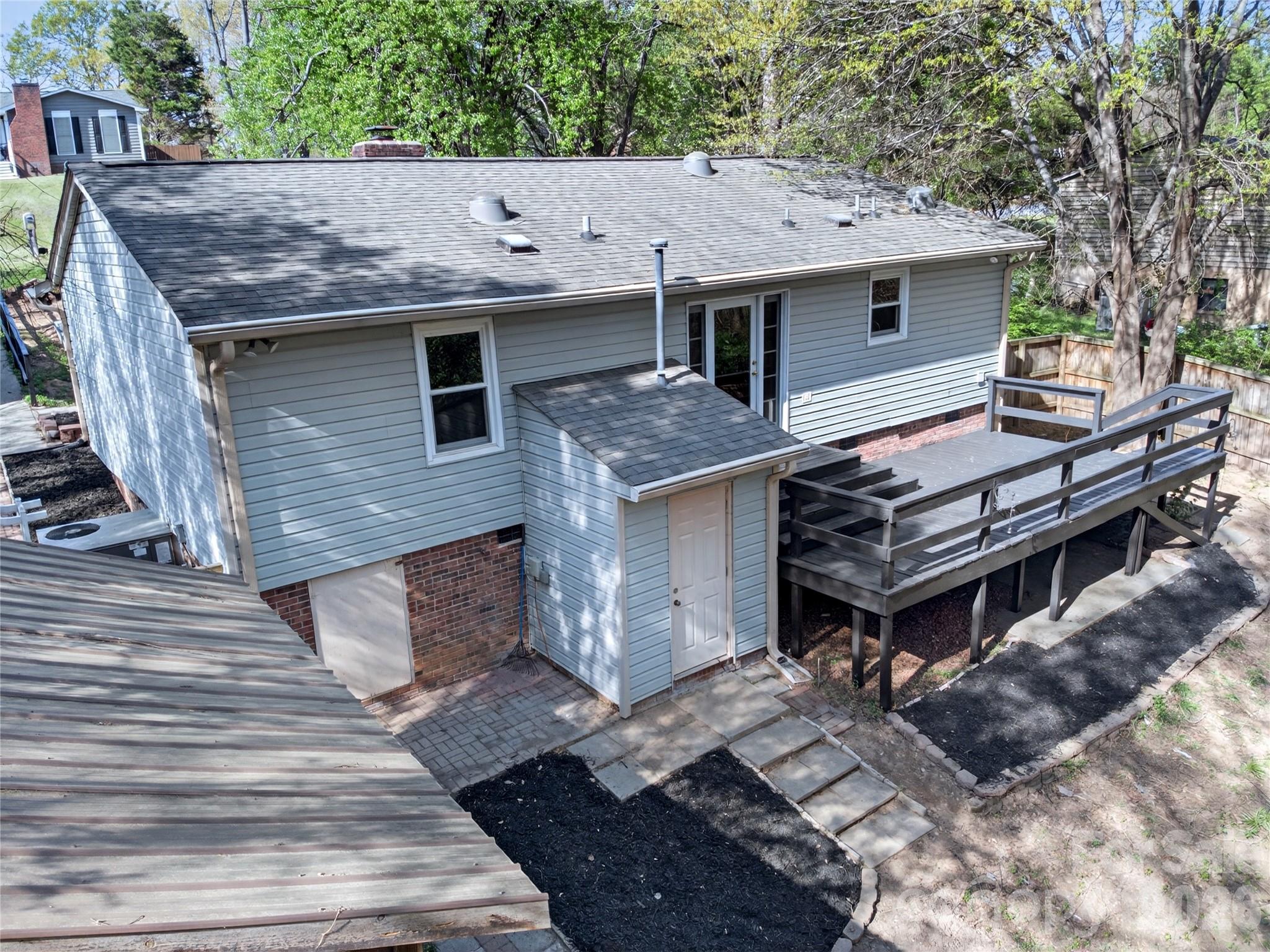 1919 Oak Hollow Road Gastonia, NC 28054 - Photo 31 of 36 a aerial view of a house with a roof deck