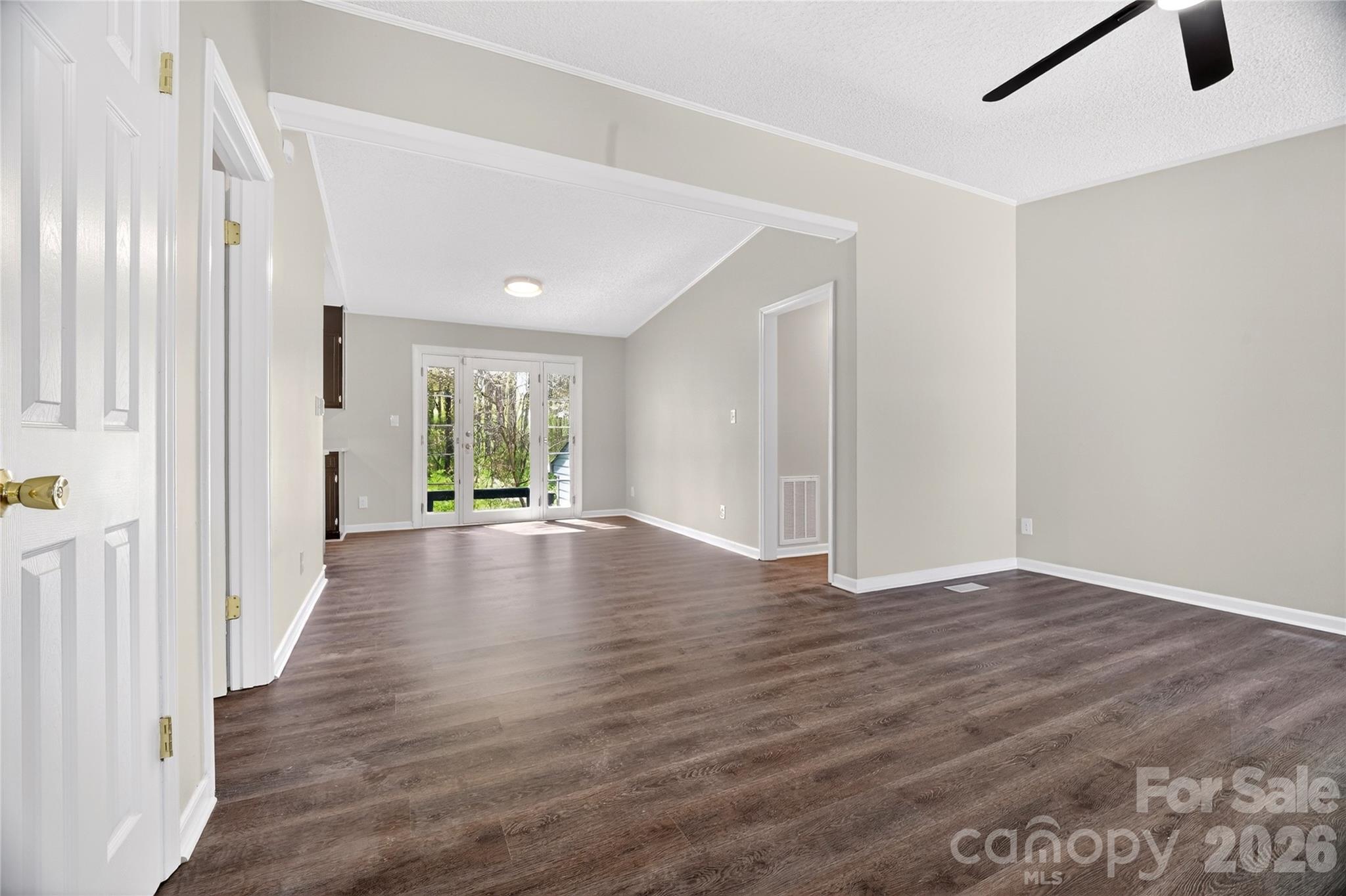 1919 Oak Hollow Road Gastonia, NC 28054 - Photo 5 of 36 an empty room with wooden floor and windows