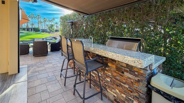 a patio with table and chairs