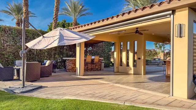 a view of a chairs and tables in the patio