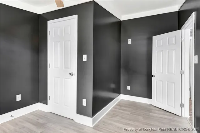 an empty room with windows and entrance