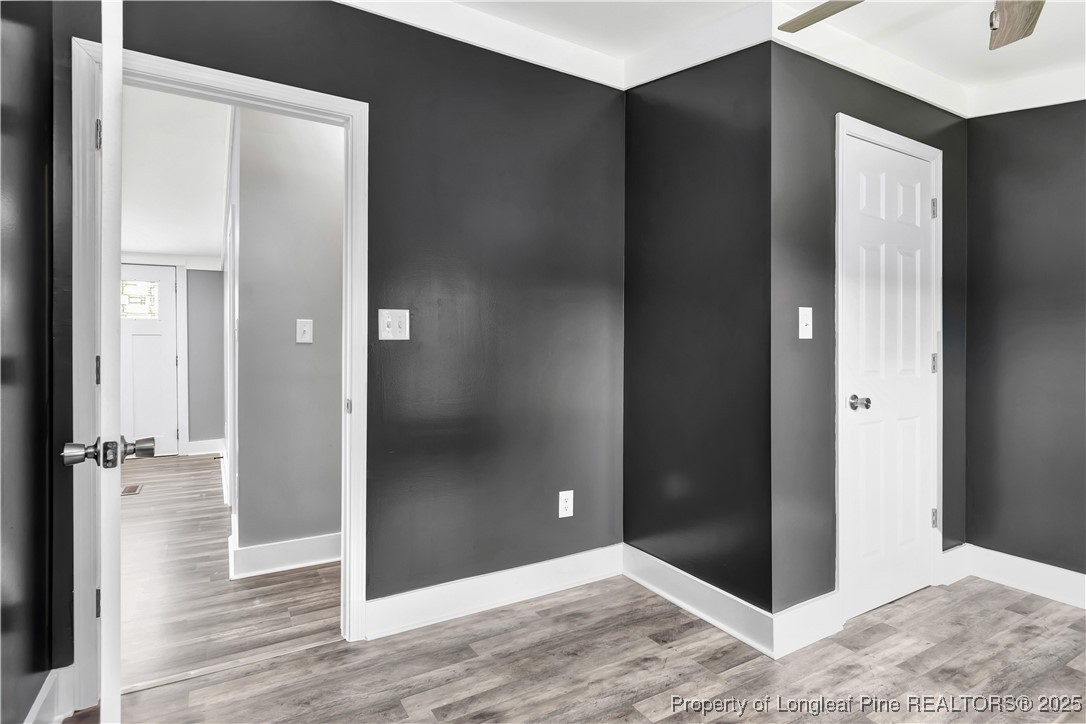 7225 Deep Branch Road Pembroke, NC 28372 - Photo 19 of 27 an empty room with wooden floor and closet