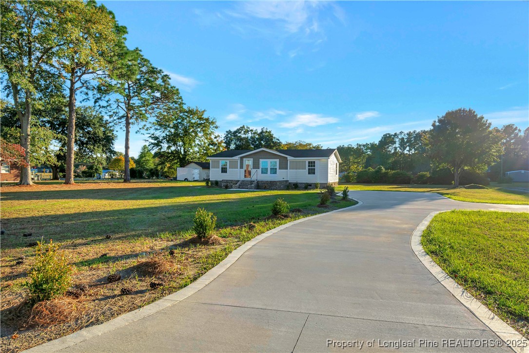 7225 Deep Branch Road Pembroke, NC 28372 - Photo 26 of 27 a view of a park with large trees