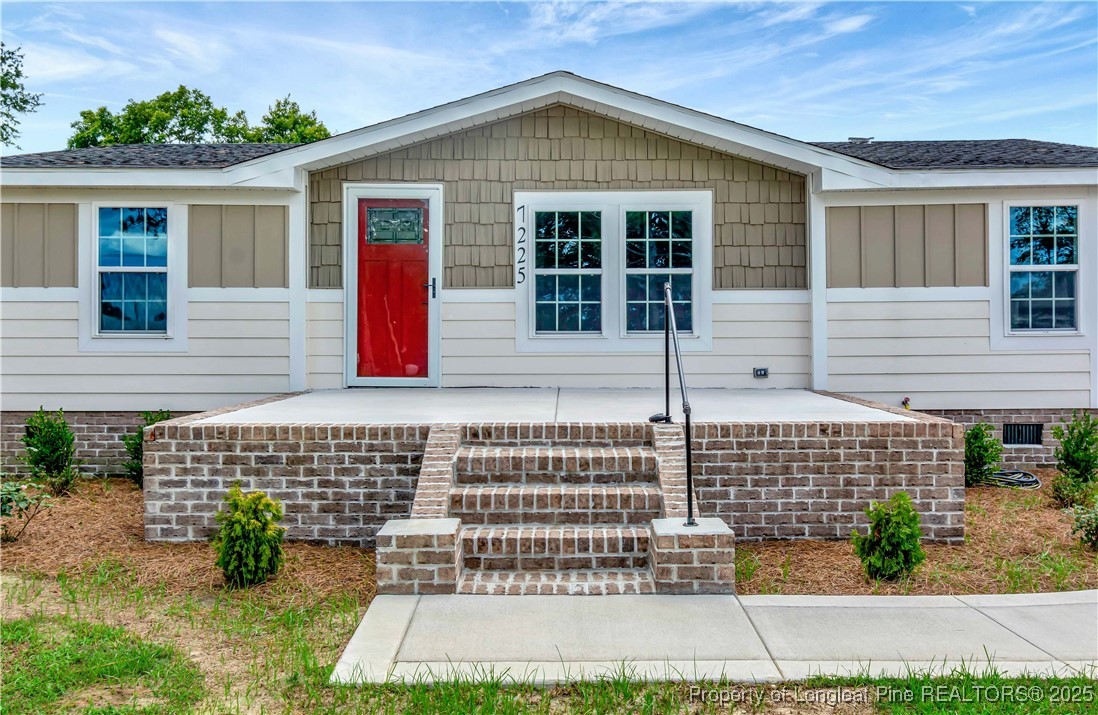 7225 Deep Branch Road Pembroke, NC 28372 - Photo 3 of 27 a front view of a house