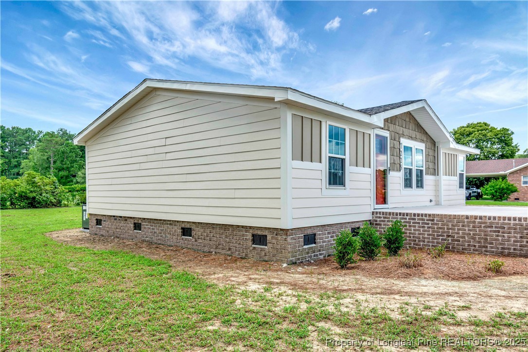 7225 Deep Branch Road Pembroke, NC 28372 - Photo 4 of 27 a backyard of a house with lots of green space