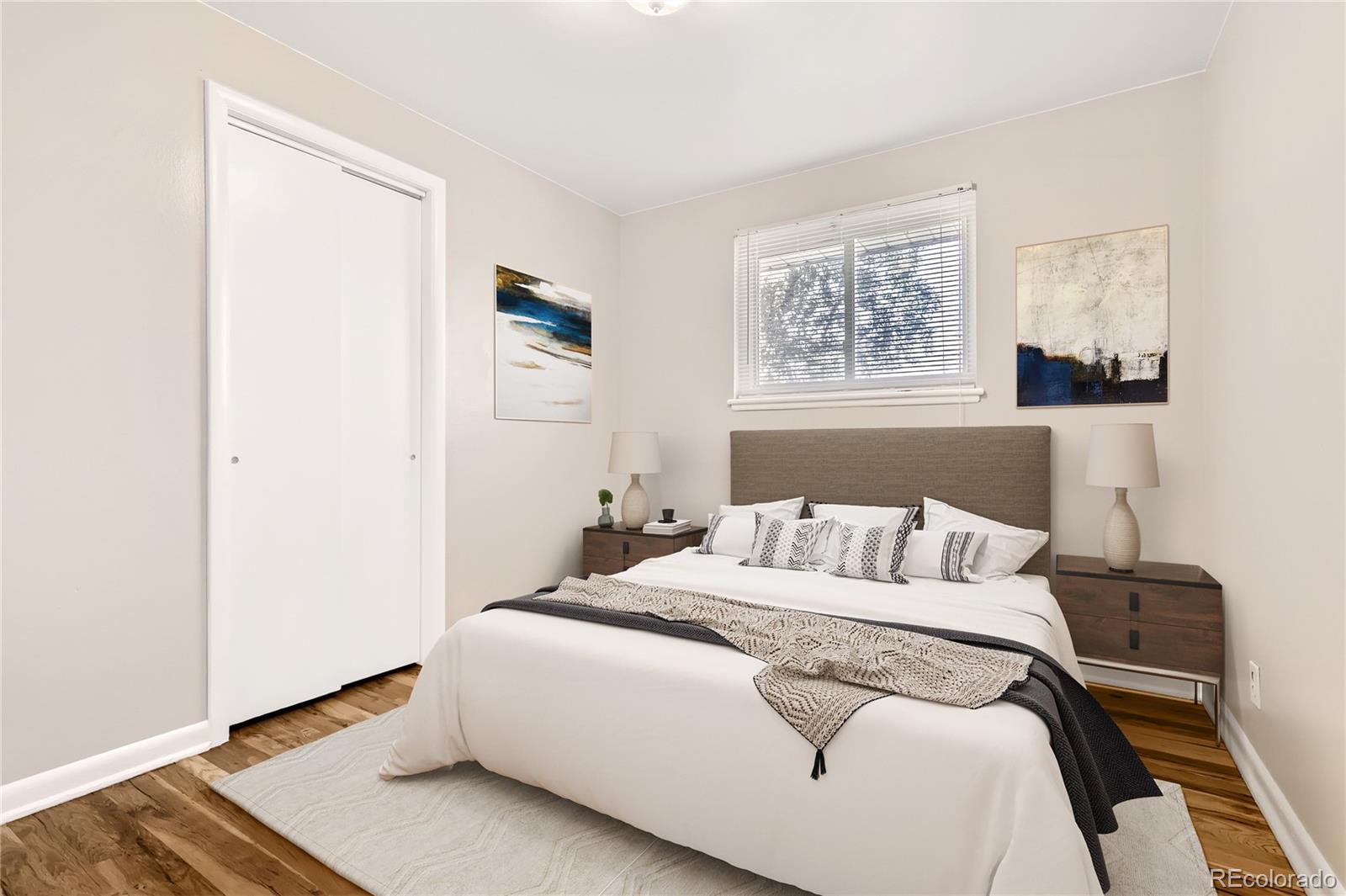 6930 North Locust Street Commerce City, CO 80022 - Photo 9 of 17 a bedroom with a bed and a window