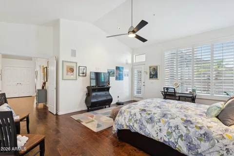 a bed sitting in a bedroom next to a window