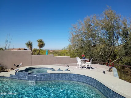 an aerial view of a house with outdoor space