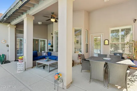 a view of a sign board with building in the background