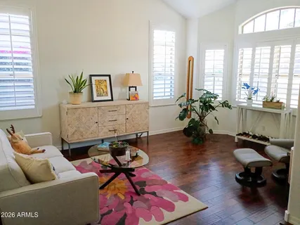 a living room with furniture fireplace and window