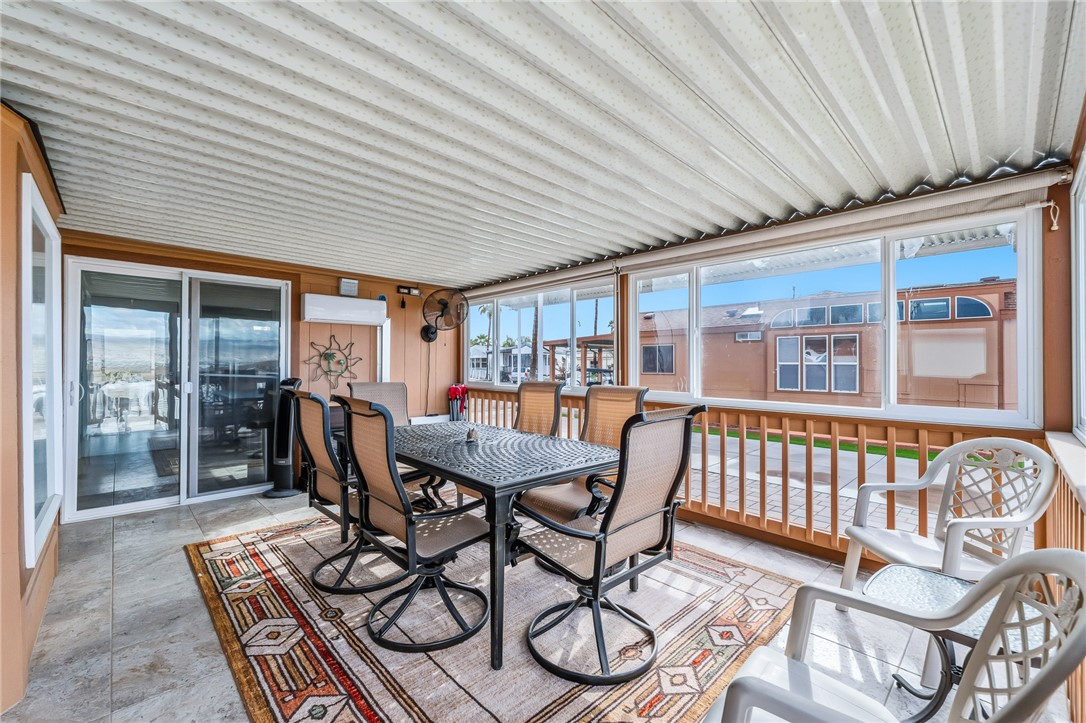 2000 Ramar Road, Unit 126 Bullhead City, AZ 86442 - Photo 28 of 65 Sunroom / solarium featuring outdoor dining space and a residential view