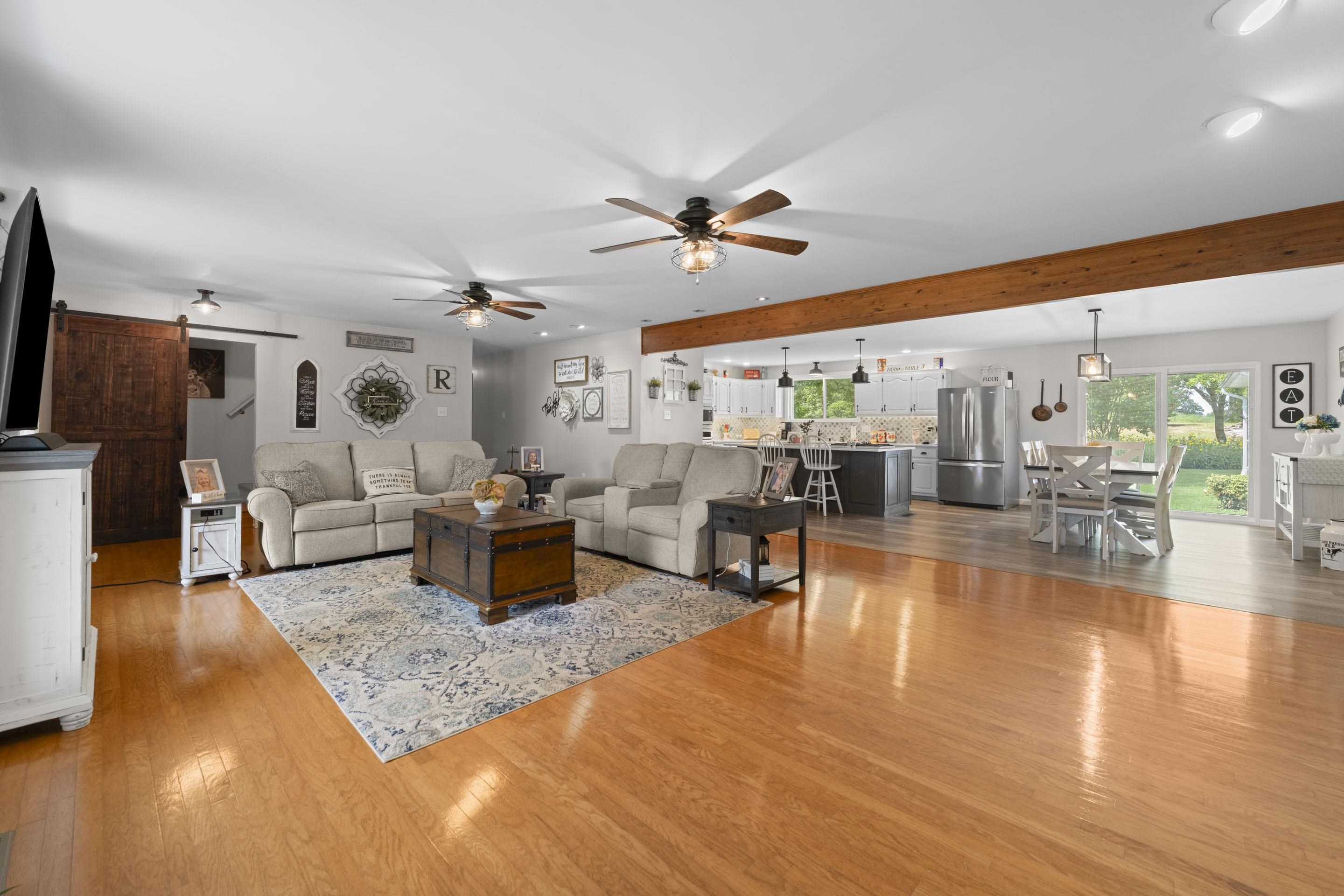 849 Belton Road Ripley, TN 38063 - Photo 12 of 40 a living room with furniture and wooden floor