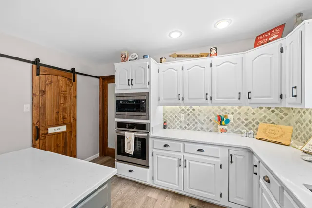 a kitchen with a sink and a window