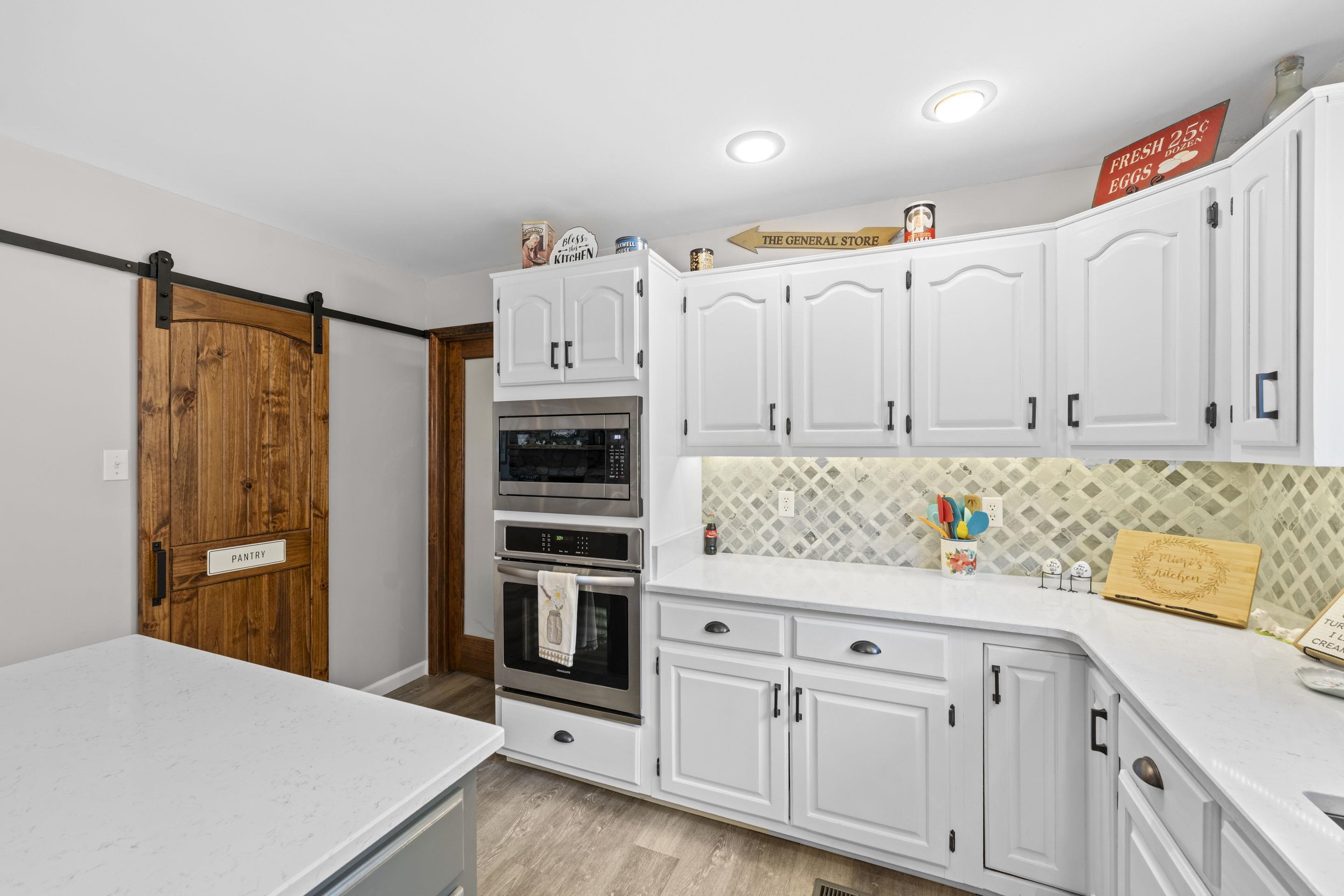 849 Belton Road Ripley, TN 38063 - Photo 17 of 40 a kitchen with cabinets and appliances