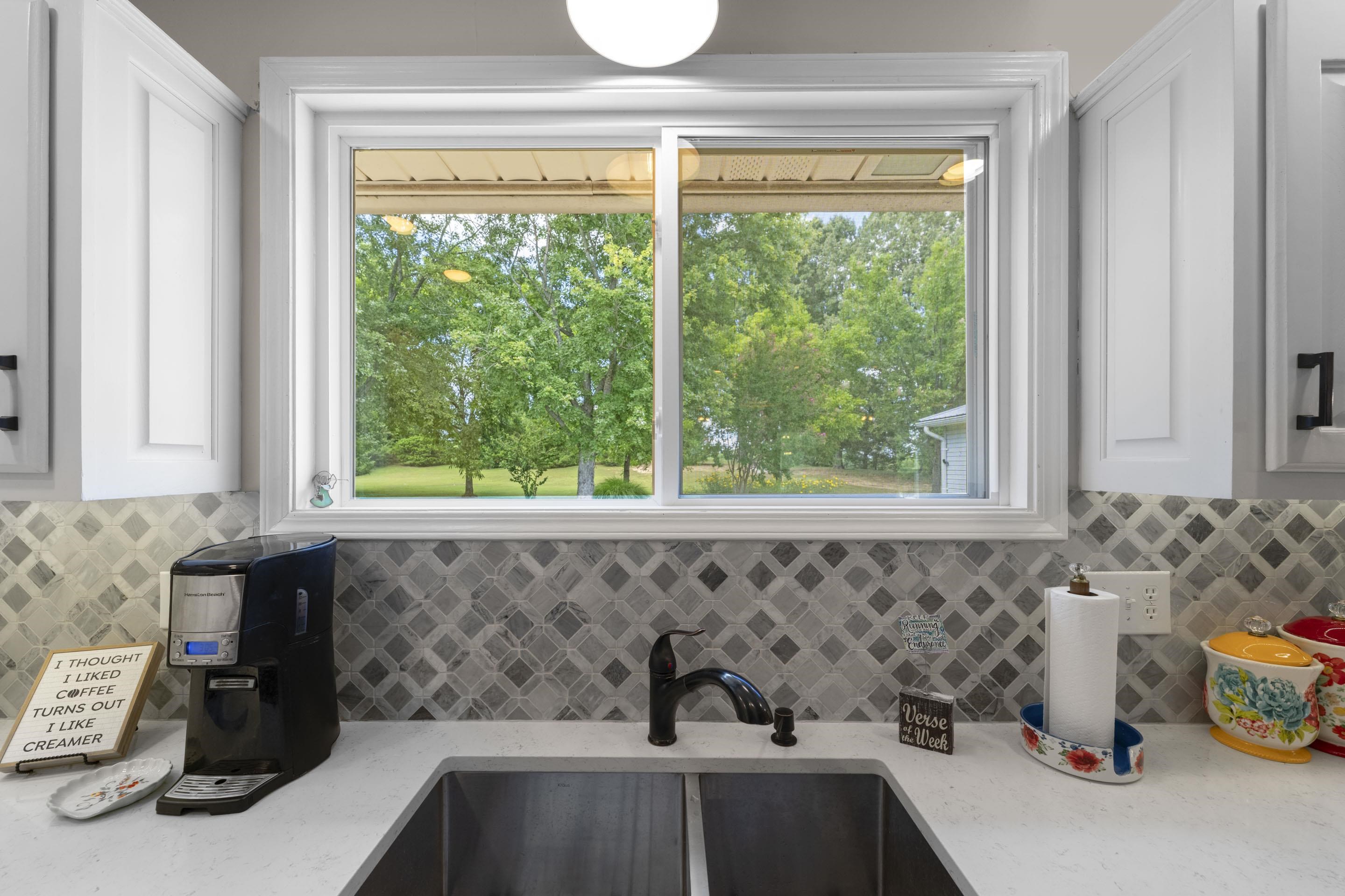 849 Belton Road Ripley, TN 38063 - Photo 18 of 40 a kitchen with a sink and a window