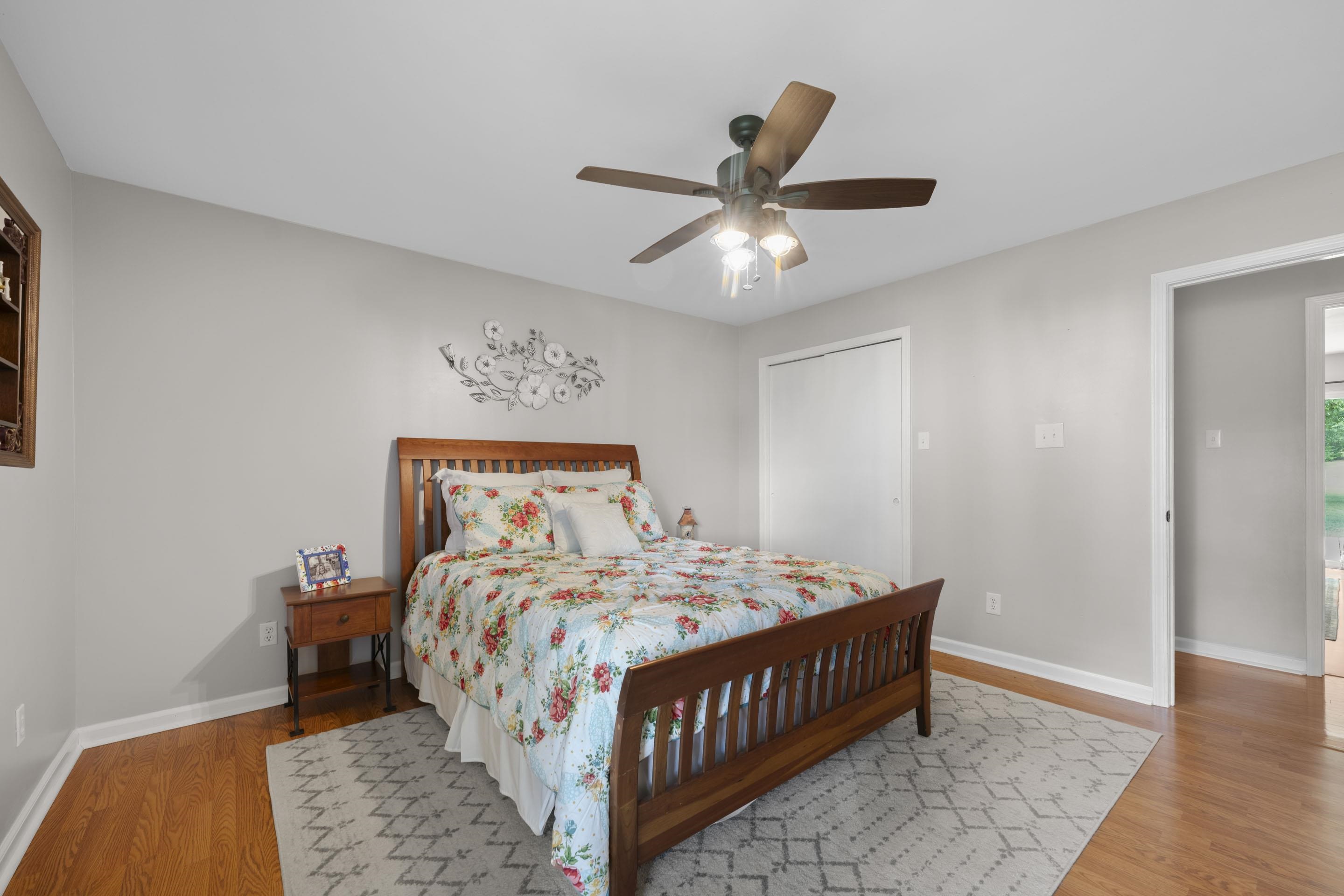 849 Belton Road Ripley, TN 38063 - Photo 25 of 40 a bedroom with a bed and a chandelier