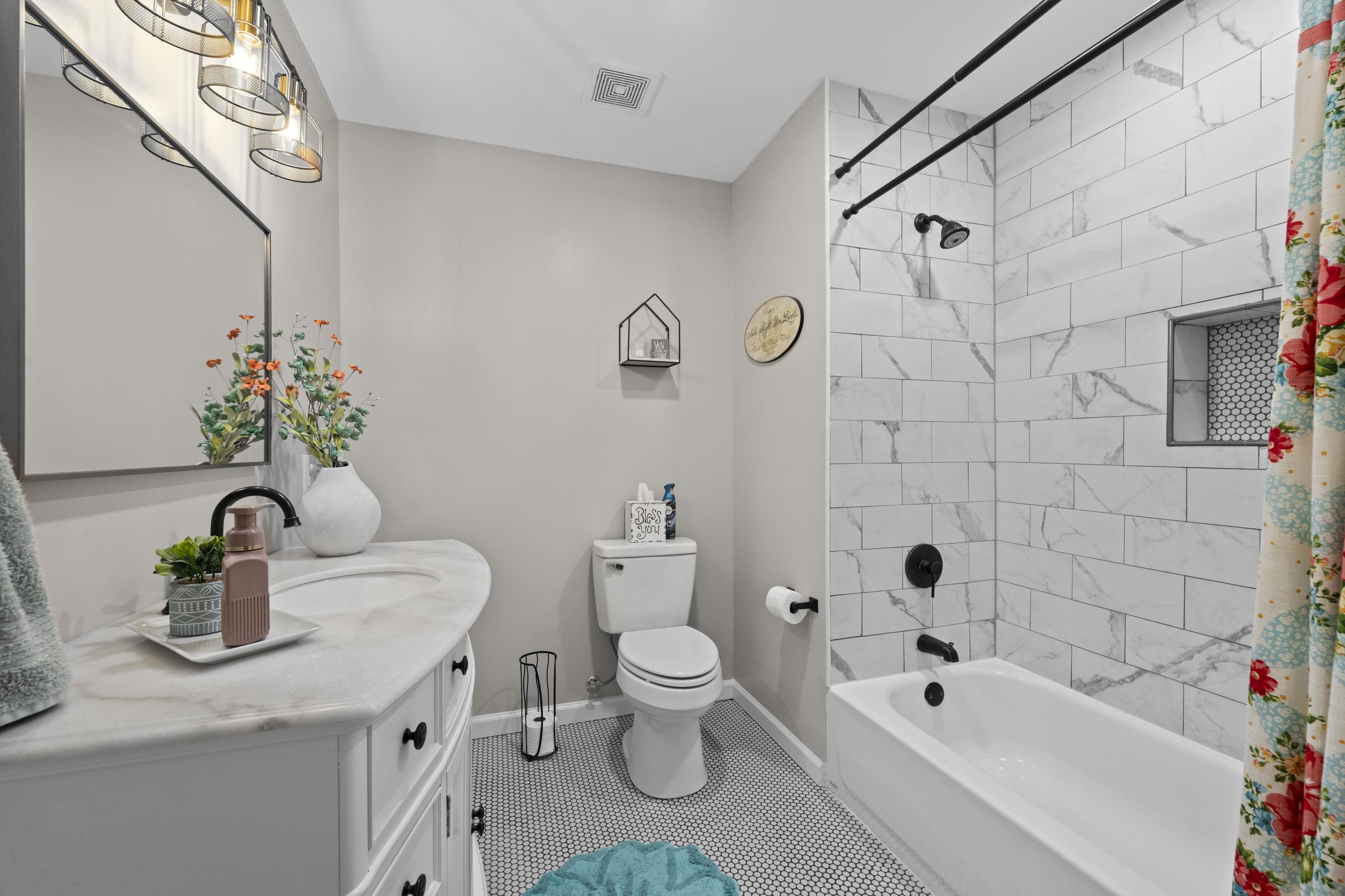 849 Belton Road Ripley, TN 38063 - Photo 26 of 40 a bathroom with a sink a toilet and shower