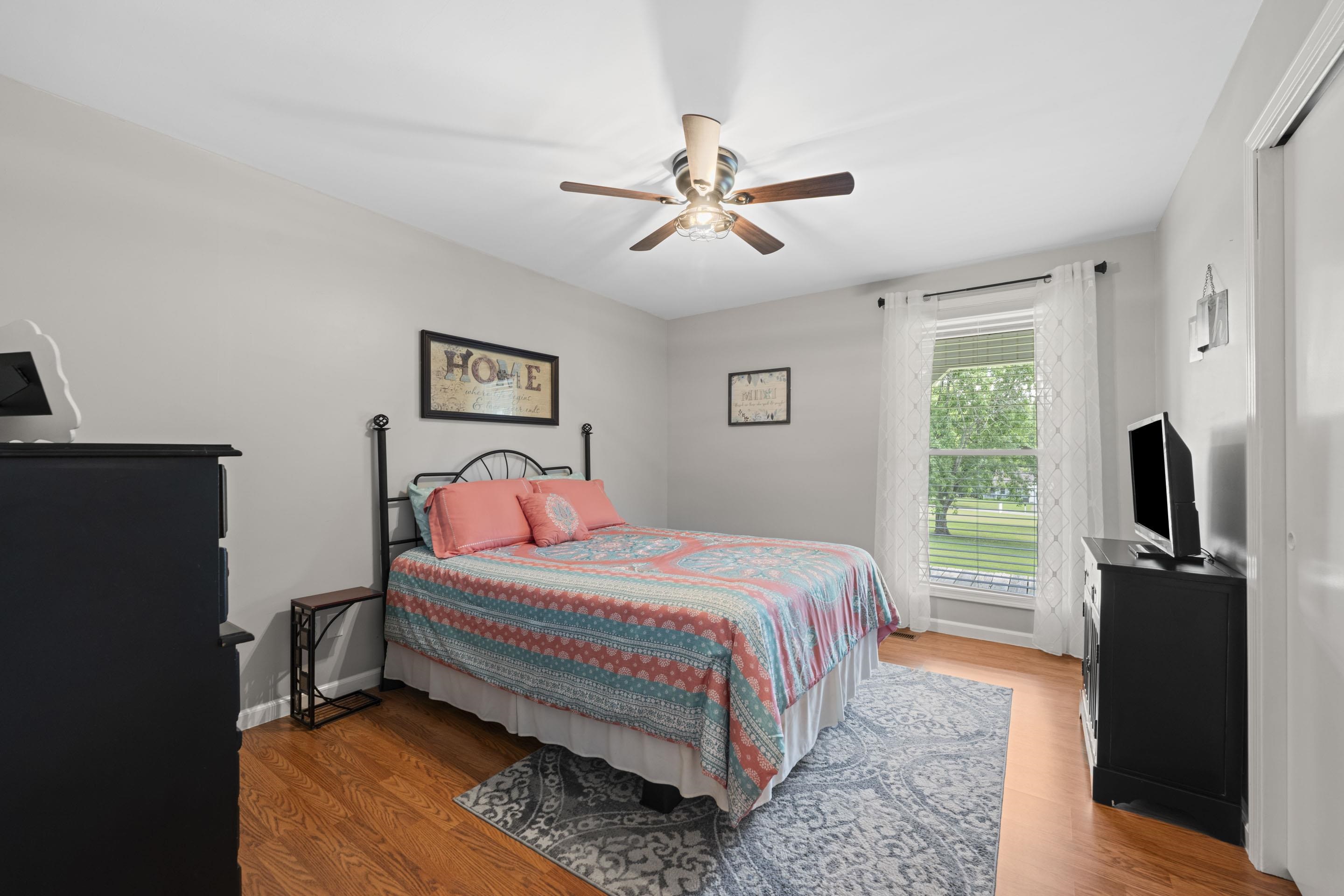 849 Belton Road Ripley, TN 38063 - Photo 27 of 40 a bedroom with a bed and a flat screen tv