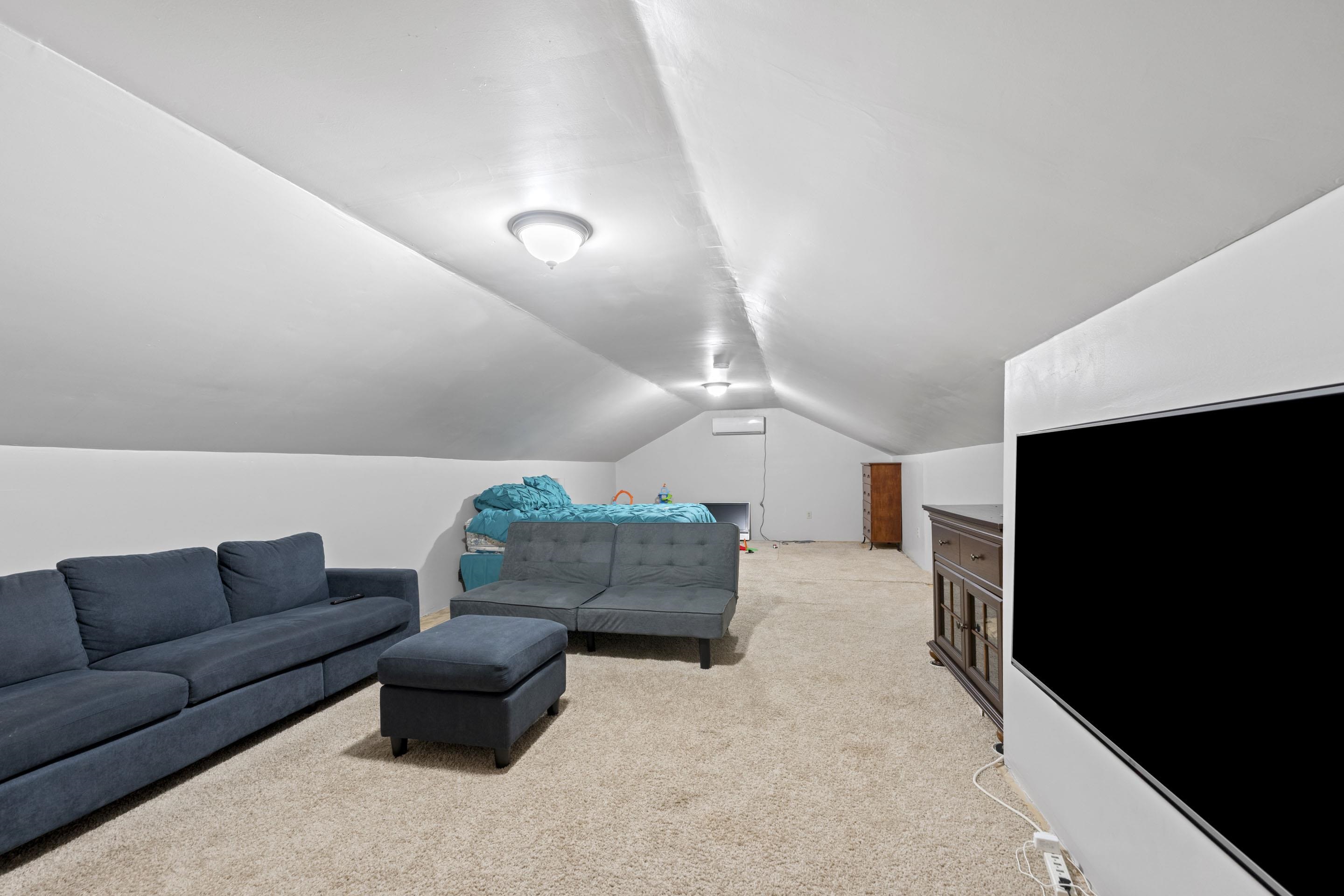 849 Belton Road Ripley, TN 38063 - Photo 28 of 40 a living room with furniture and a flat screen tv