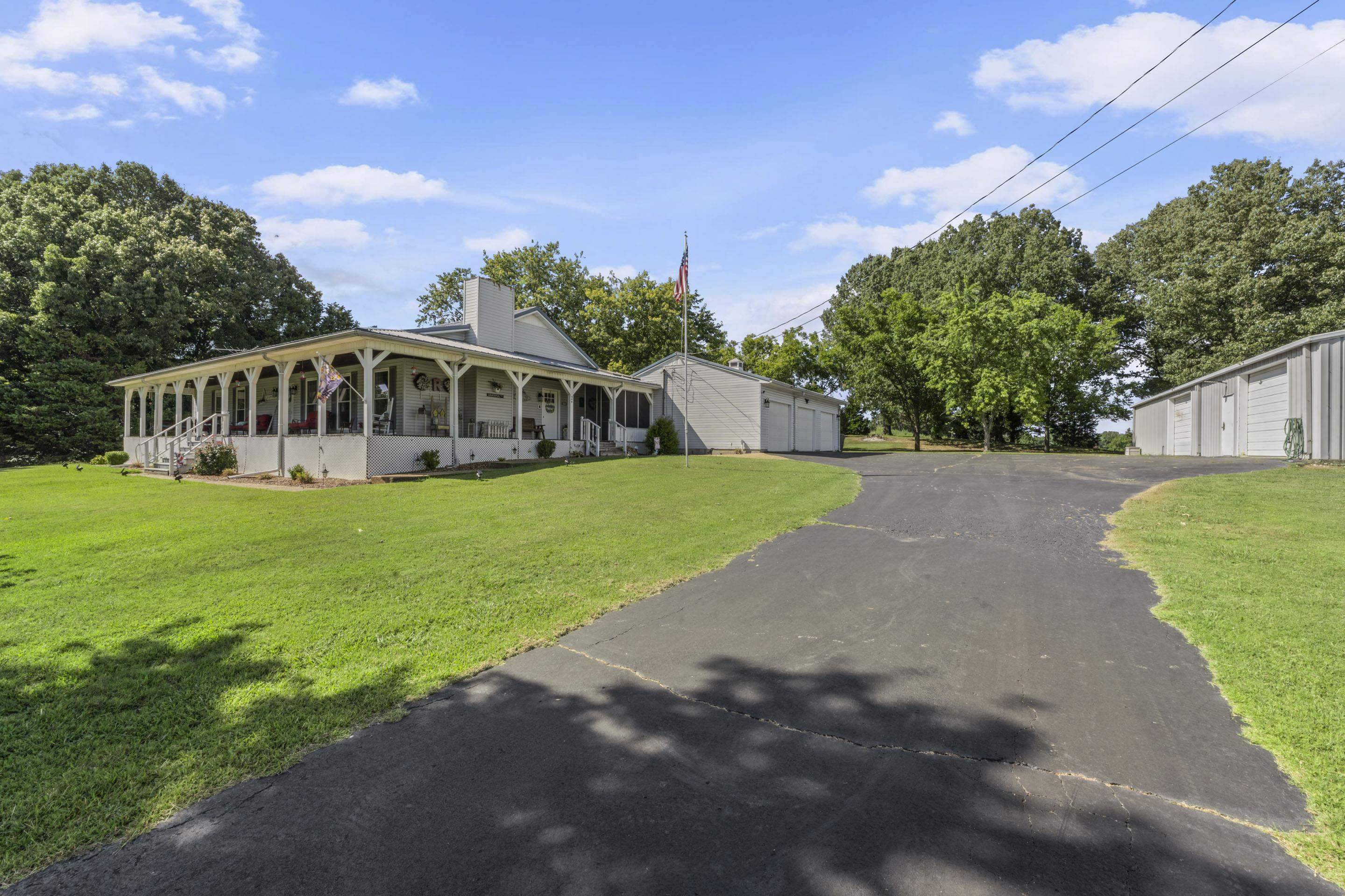 849 Belton Road Ripley, TN 38063 - Photo 29 of 40 a view of a house with a yard and a porch