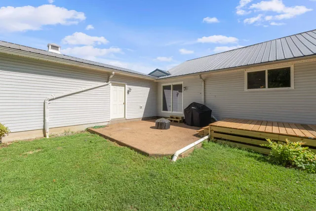 an aerial view of a house with swimming pool and outdoor space
